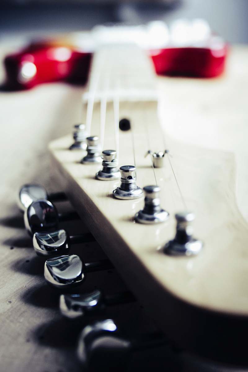 leisure activities selective focus photography of electric guitar musical instrument